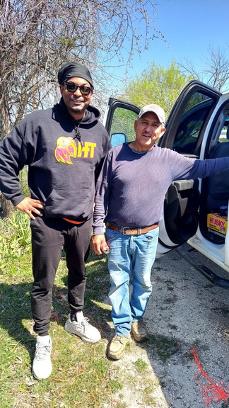 Two volunteers at a cemetery clean-up day