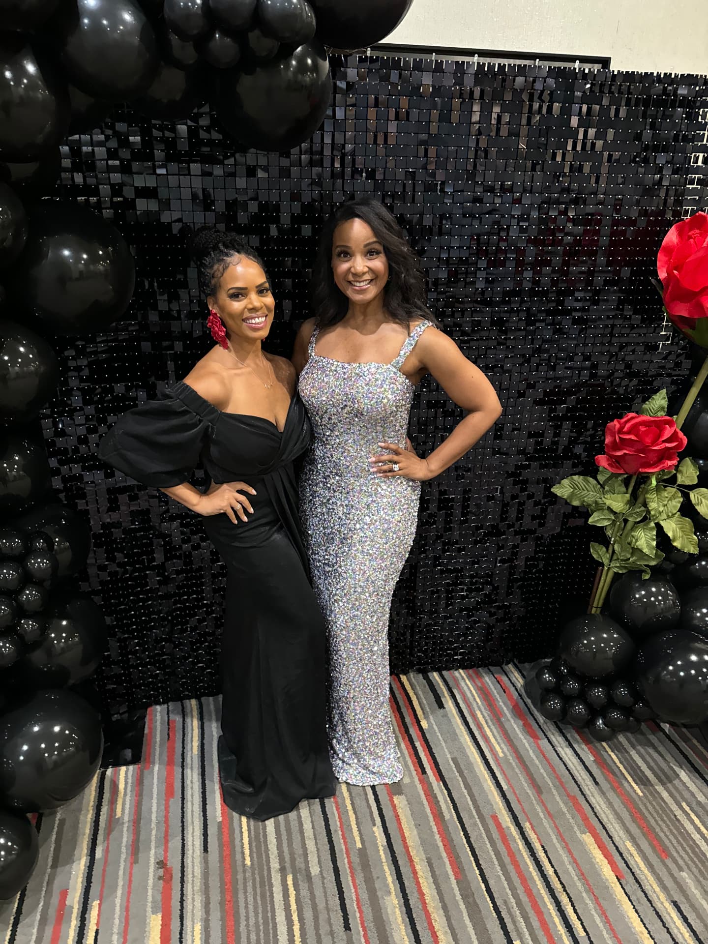 Two guests in evening gowns at The Rose Ball